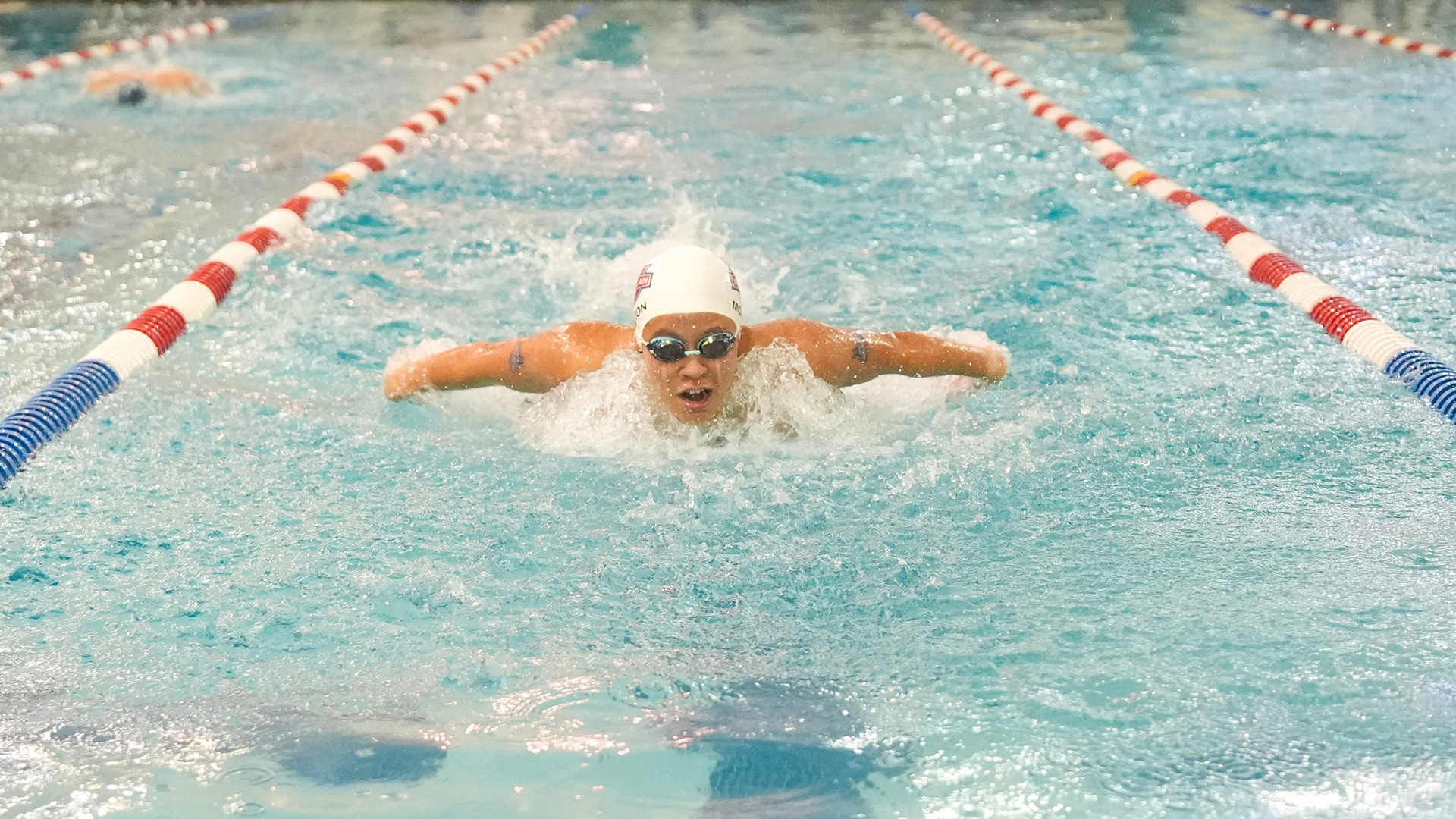 Madison Stover swimming in the Potomac Relays