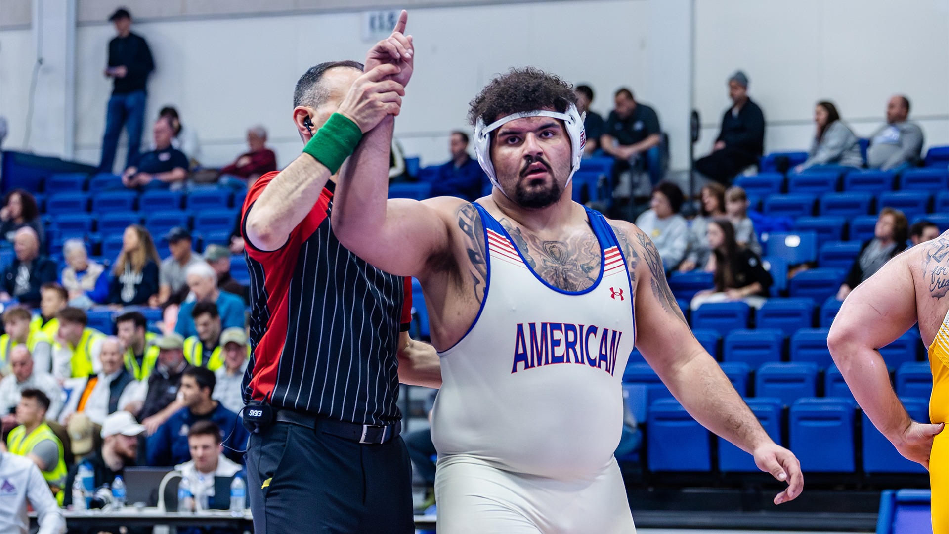 Emmanuel Ulrich getting his arm raised after winning a match at the EIWA Championships.