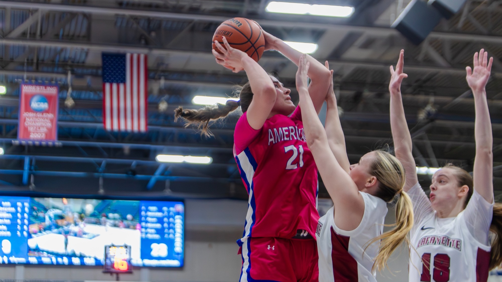 Charlotte Tuhy making a jump shot over two Lafayette defenders