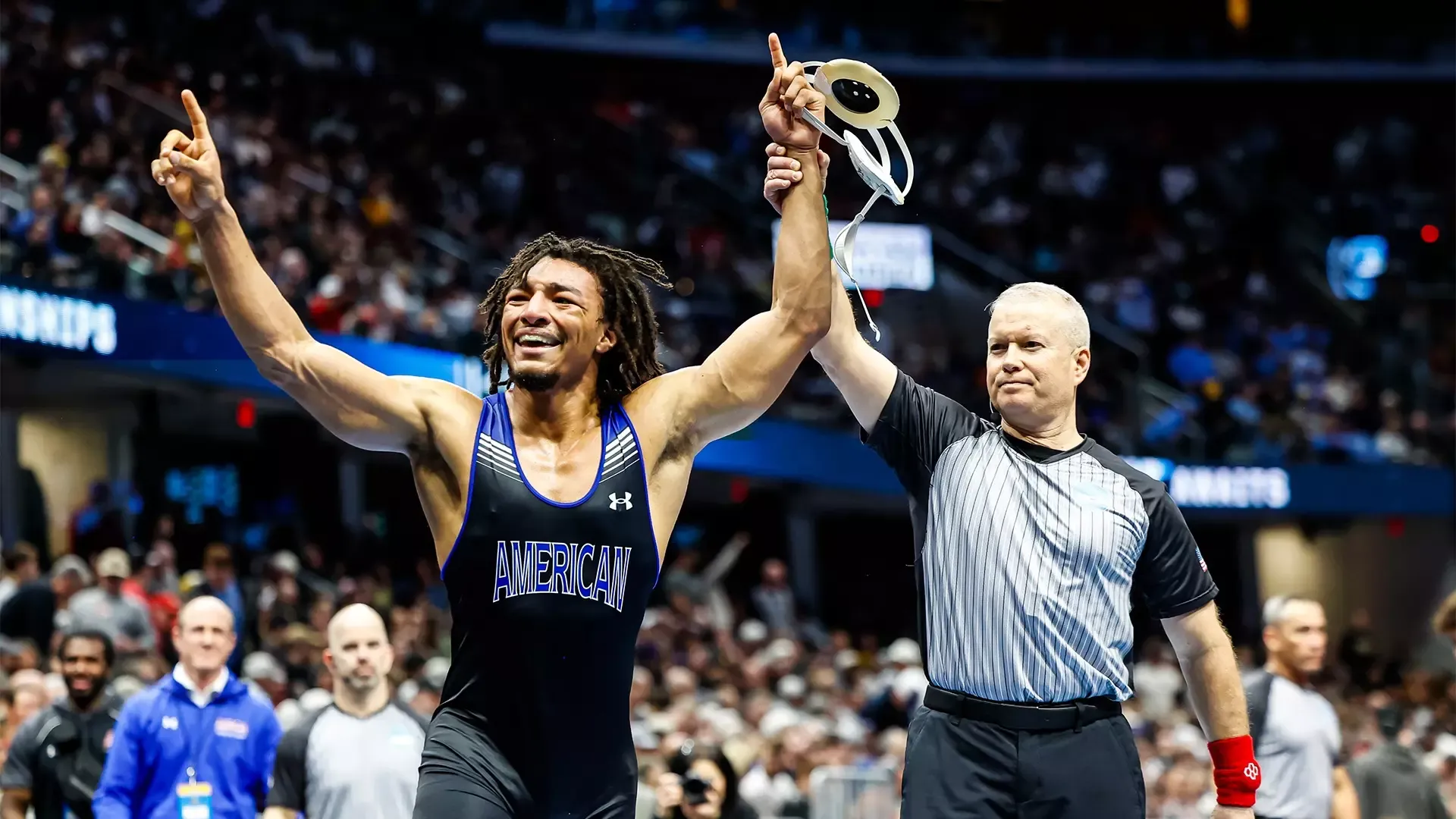 Caleb Campos getting his arm raised after winning in the blood round of the NCAA Wrestling Championships 2026, becoming an All-American. 