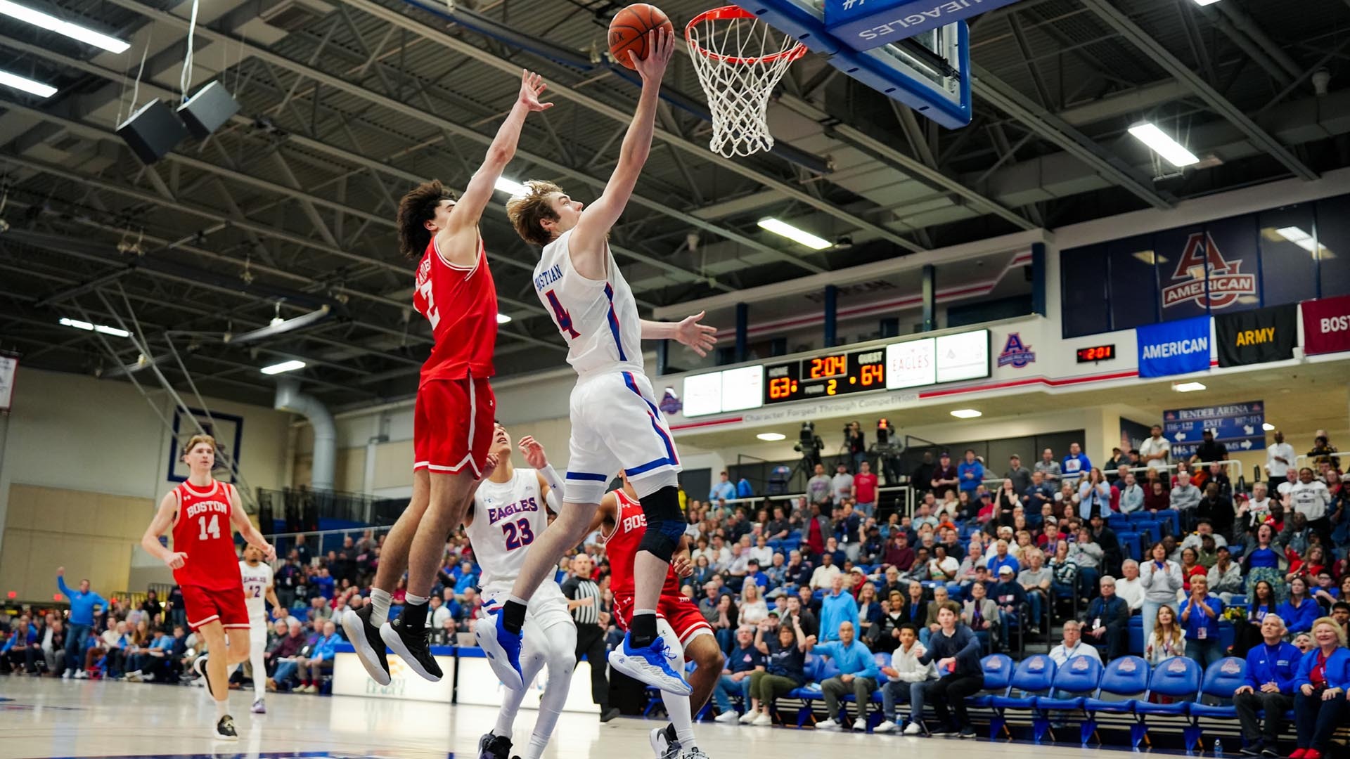 Kade Sebastian taking a layup in a men's basketball game against Boston University