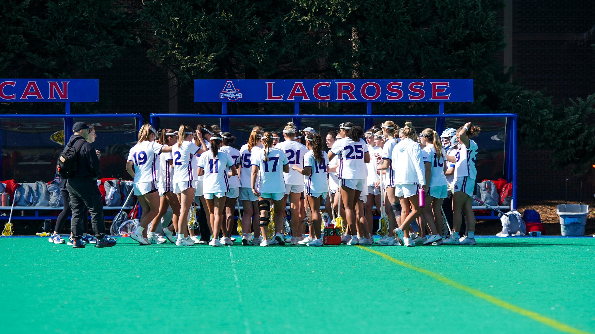 The American University lacrosse team in a huddle during a game against George Mason. 