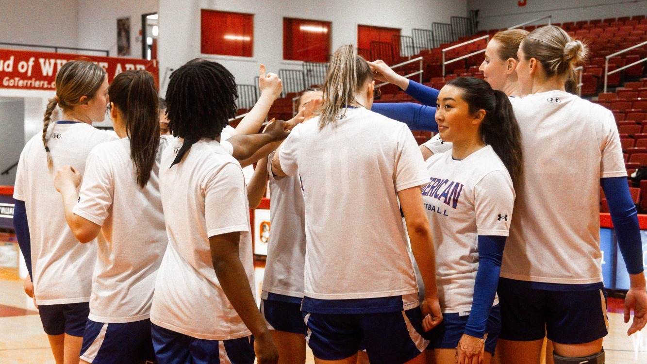 Women's Basketball huddles on the court before their game against Boston University.