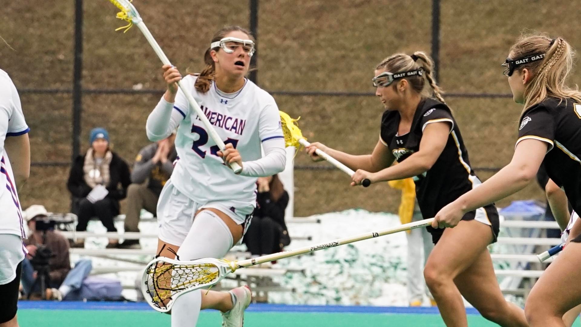 Reagan Murdoch with the ball during a women's lacrosse game against UMBC