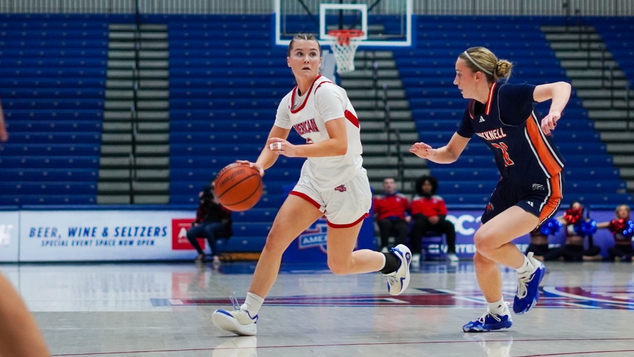 Molly Driscoll driving down the court in Bender Arena against Bucknell.