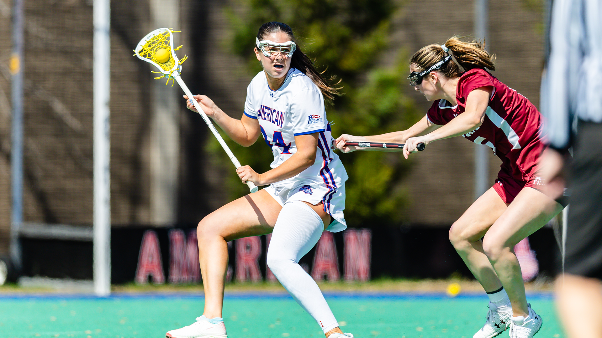 Reagan Murdoch playing lacrosse.