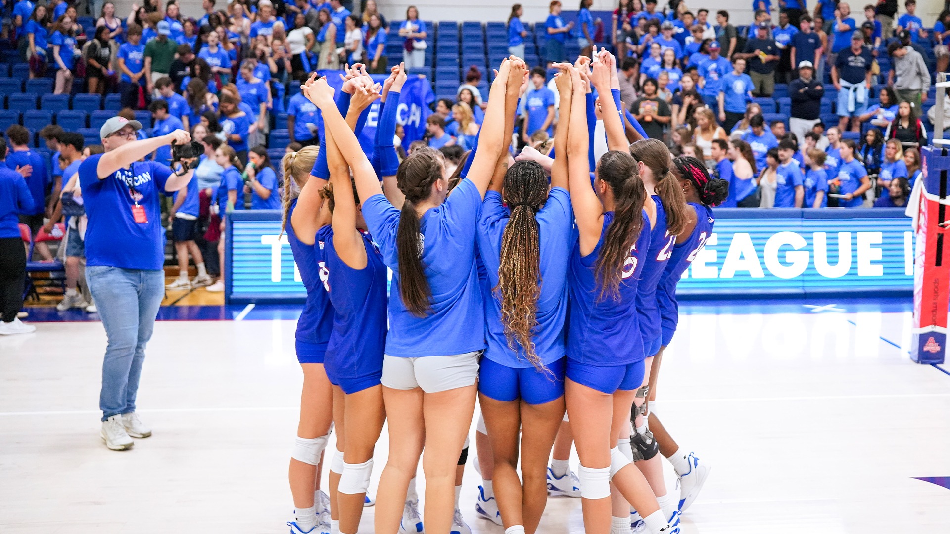 The volleyball team in a huddle