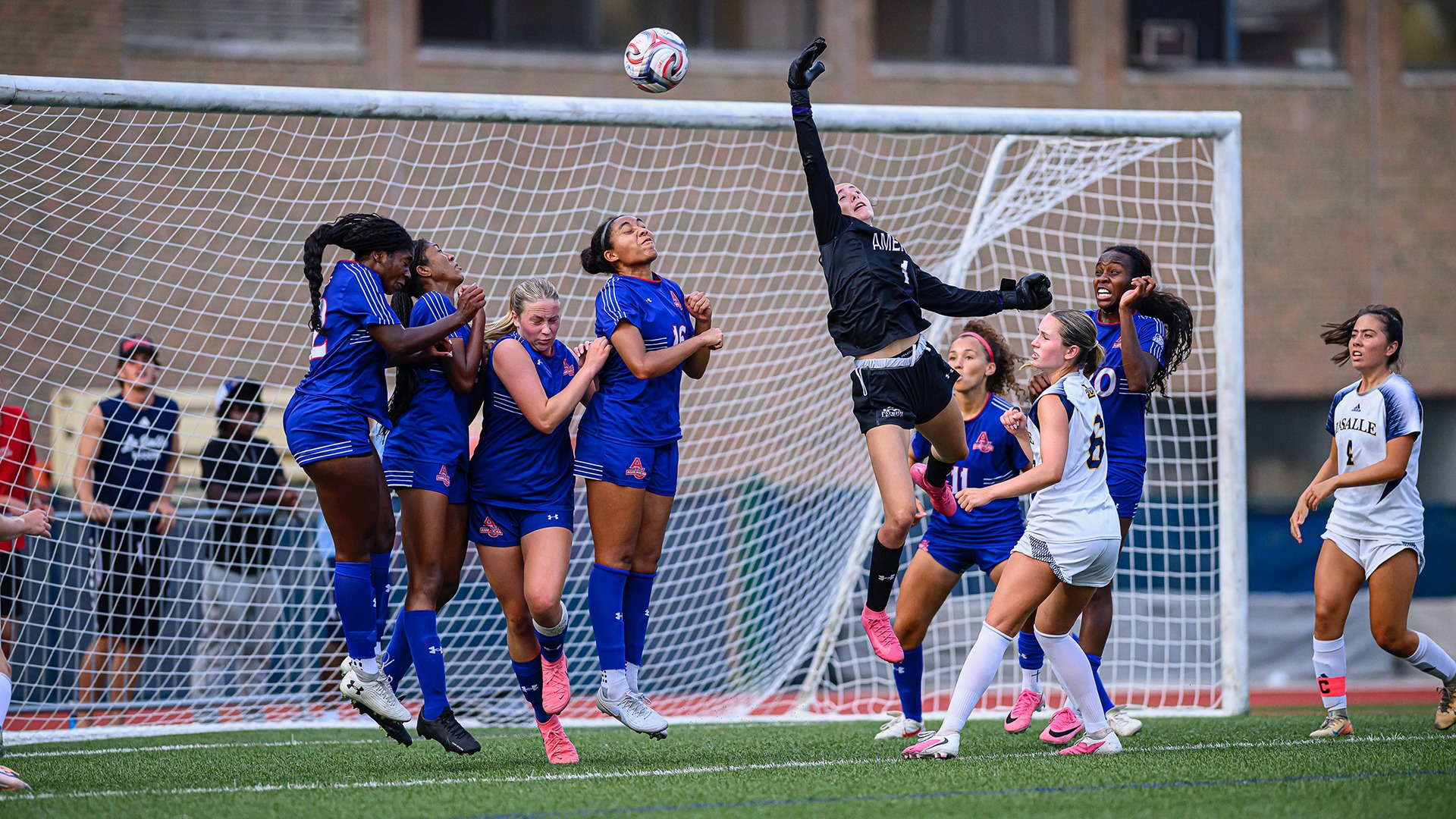 Riley Molbury looking to grab the ball during a women's soccer game at La Salle