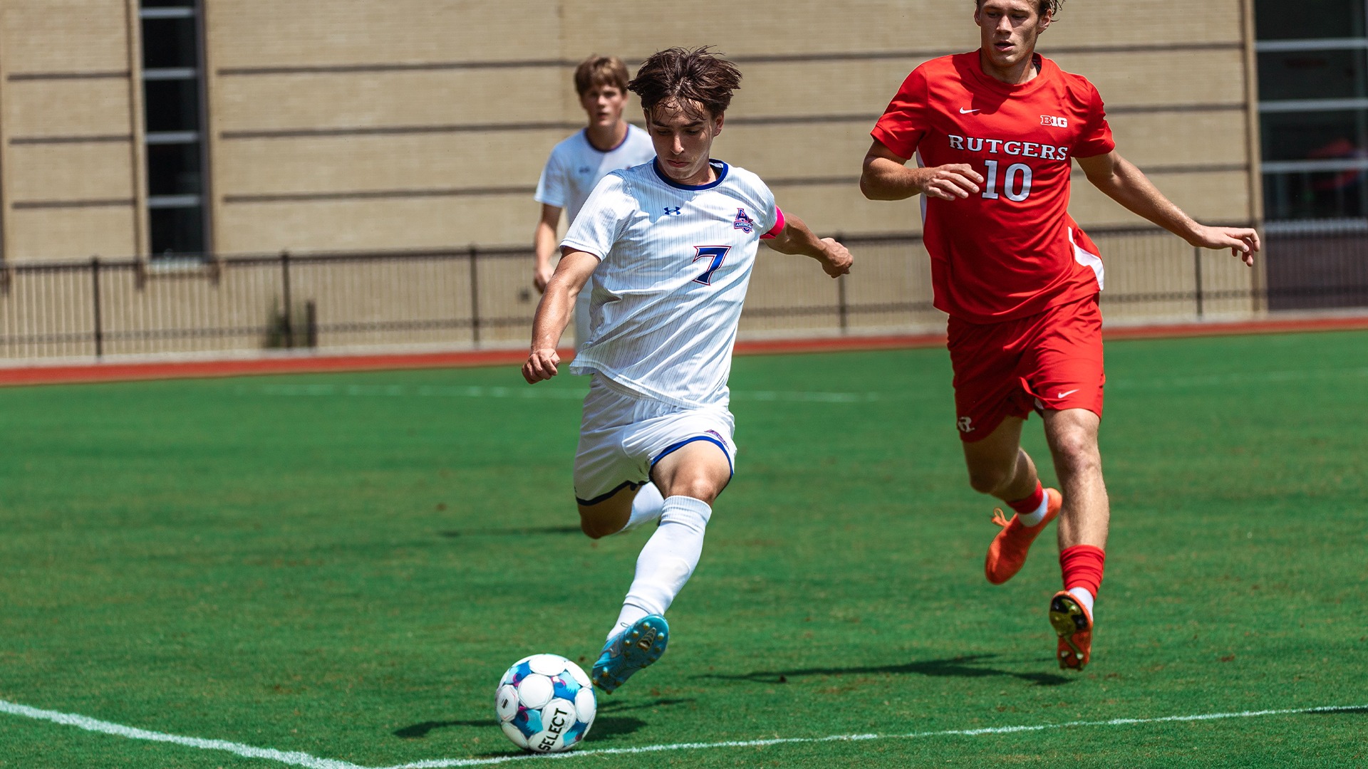 Chris Sullivan kicking the ball. 