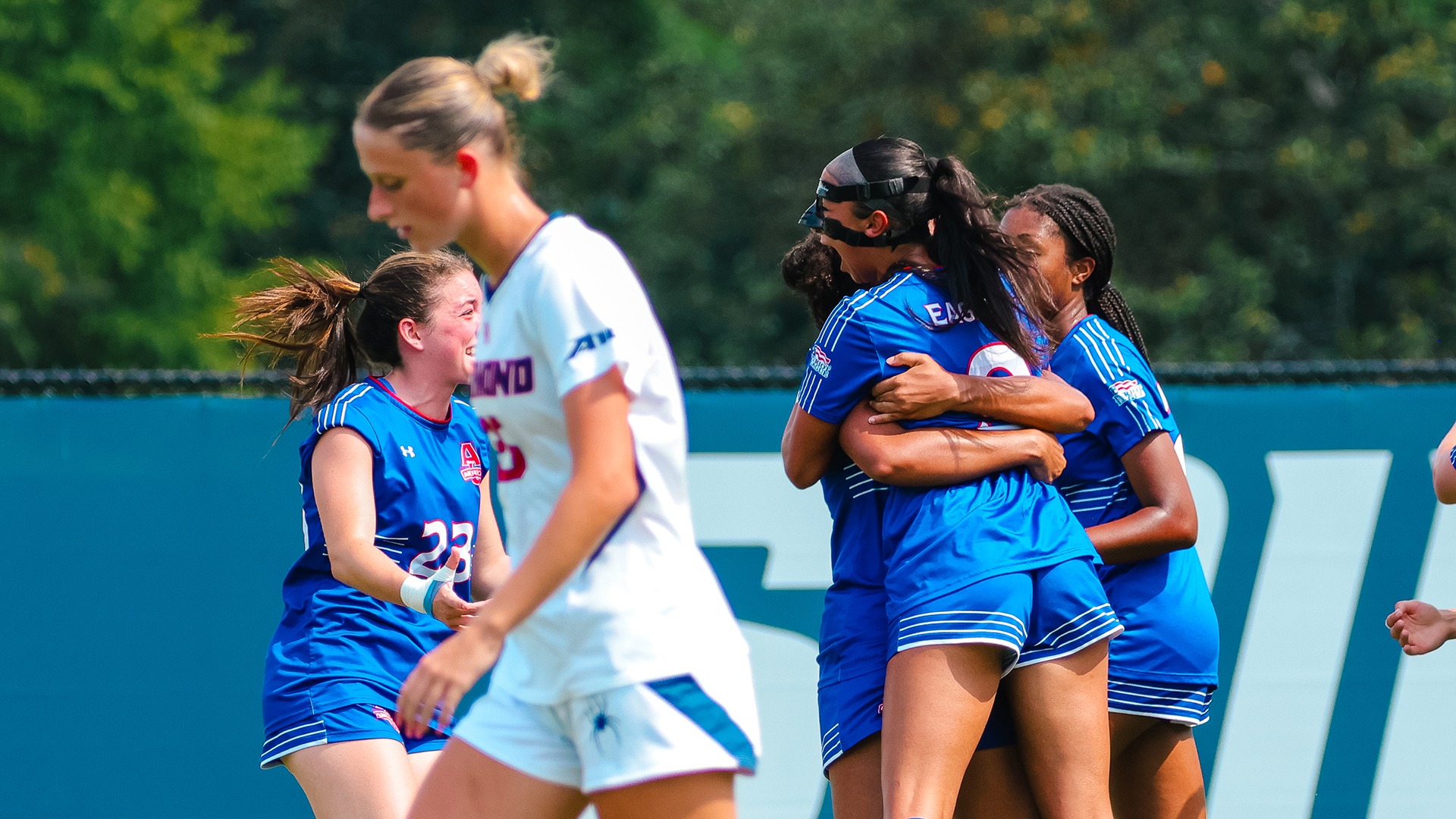 women's soccer players celebrating a goal by Mia De Villegas-Decker at Richmond on August 20, 2026