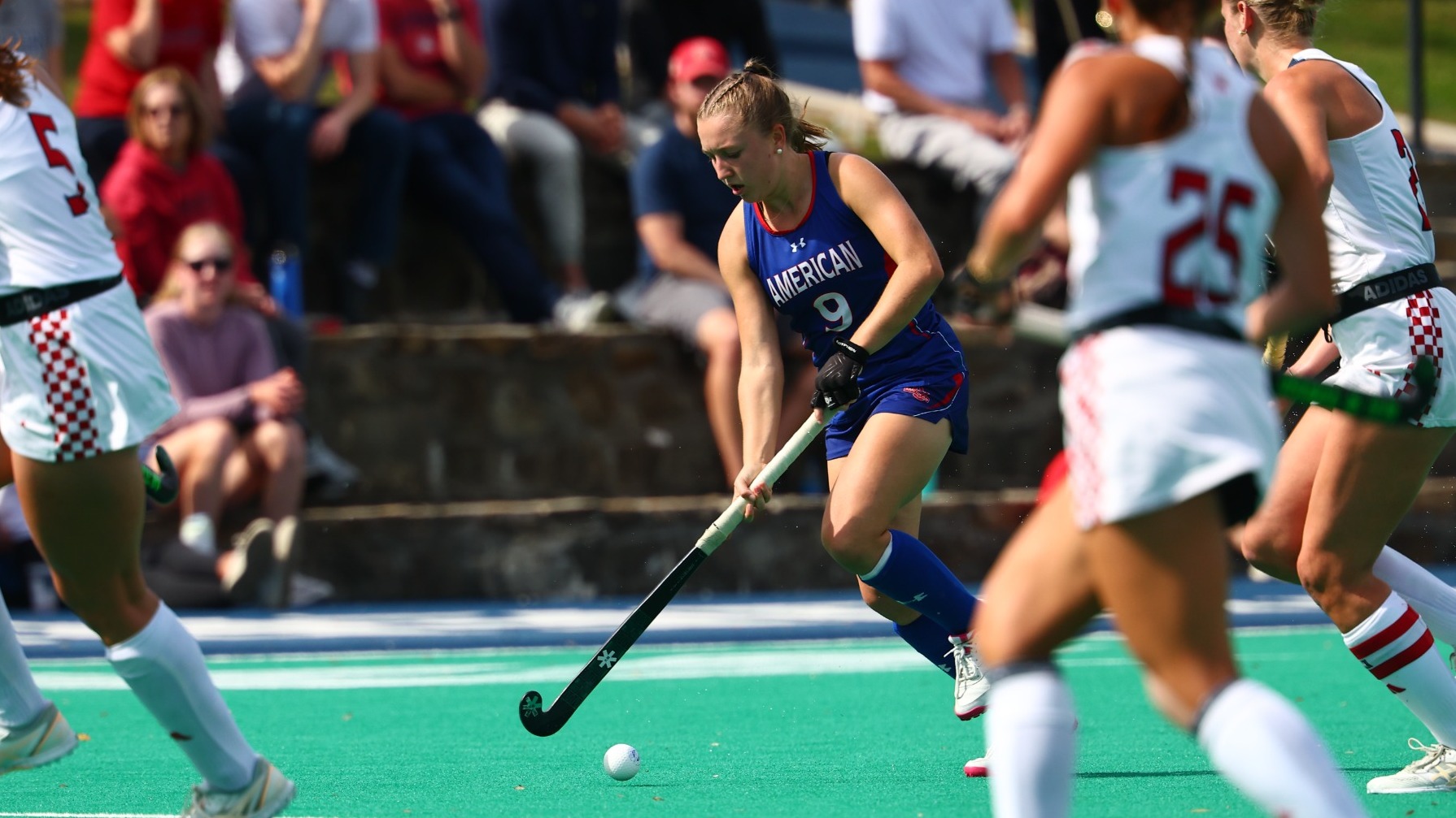 Ashley Huddleston carries the ball down the turf against Richmond.