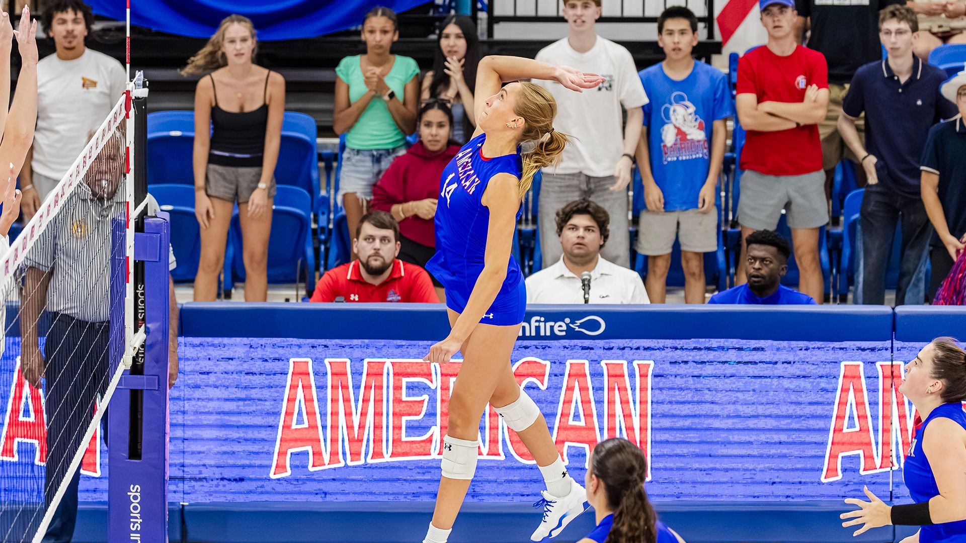 Elise Sterling jumping for an attack in volleyball.