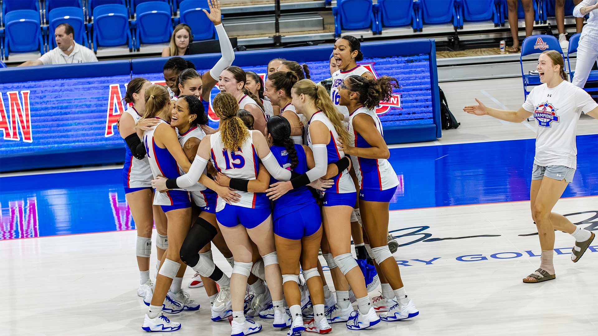 The American University volleyball celebrating after a win over Iowa State. 