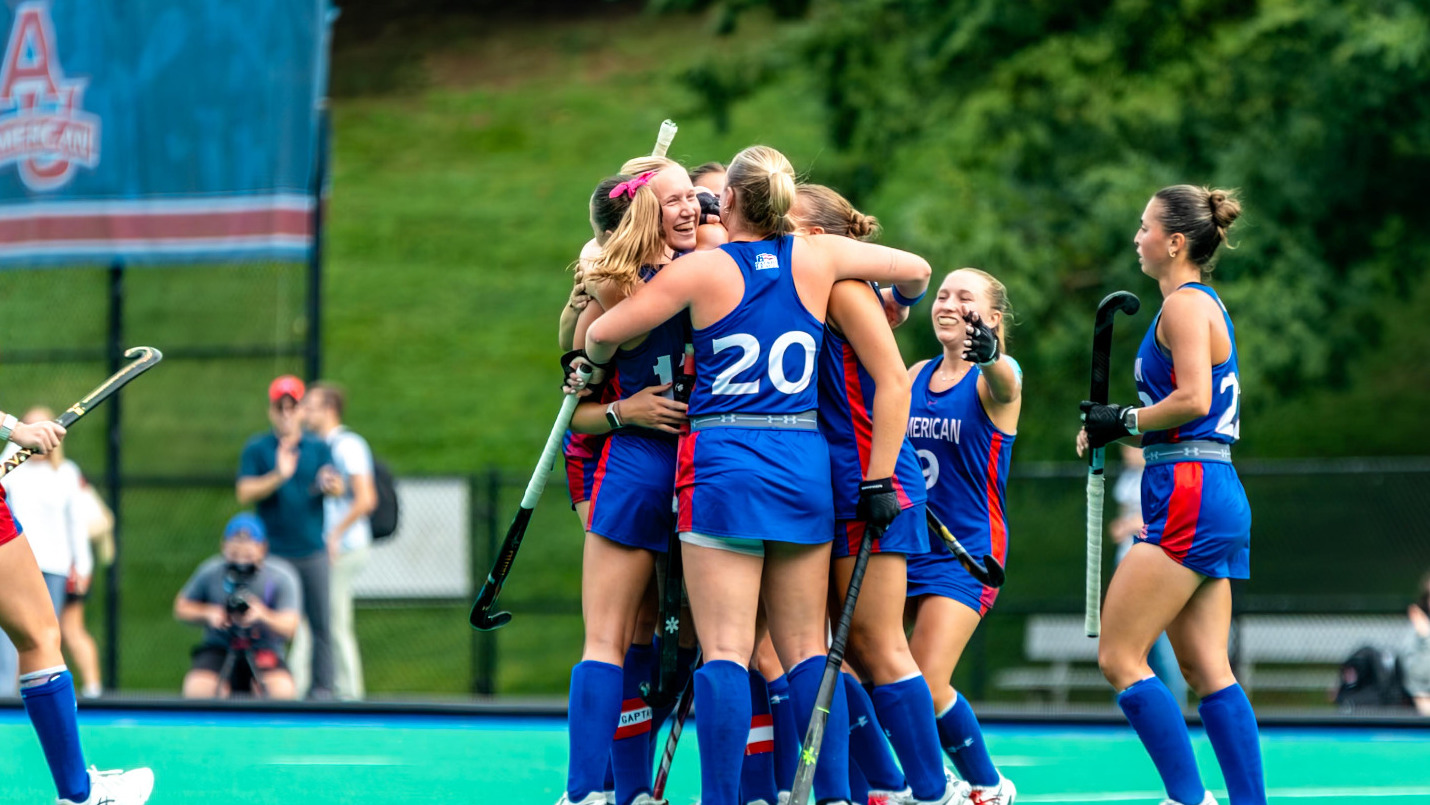 Field hockey celebrates a goal against William & Mary on Jacobs Field.