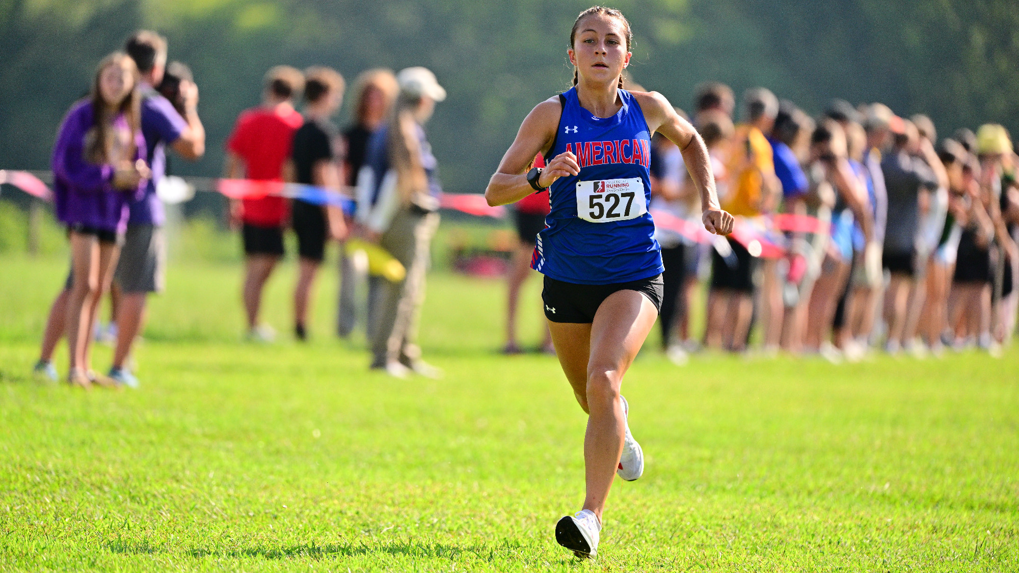 Anna Villavicencio racing to a ninth place finish at the Spider Alumni Open.