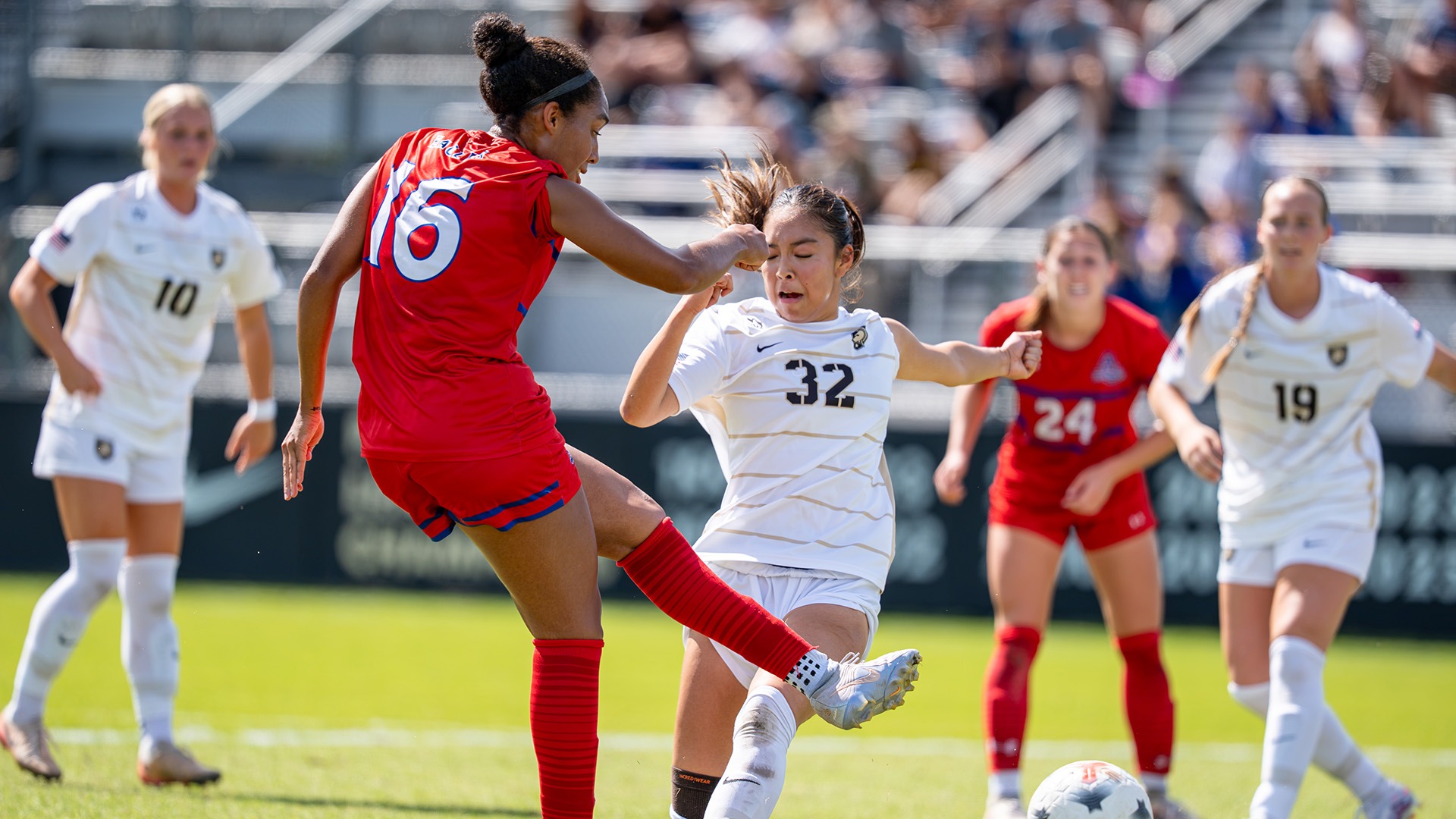 Nariah Goldman kicking the ball at Army