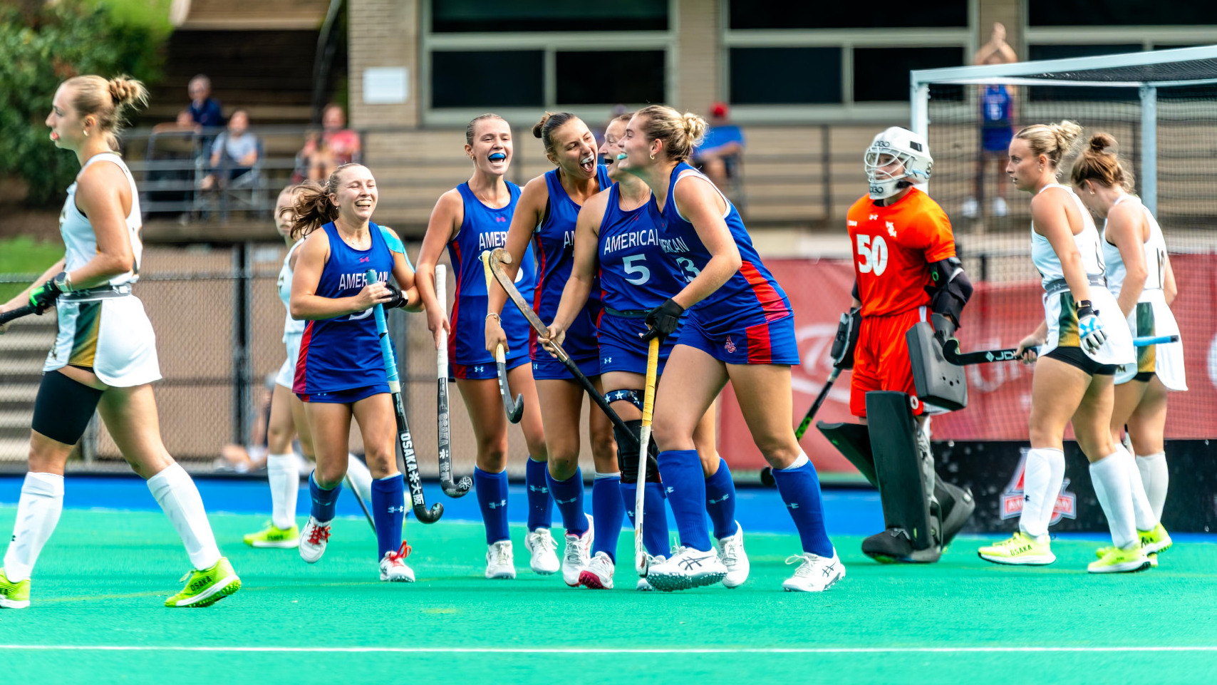 Field Hockey celebrating a goal against William & Mary