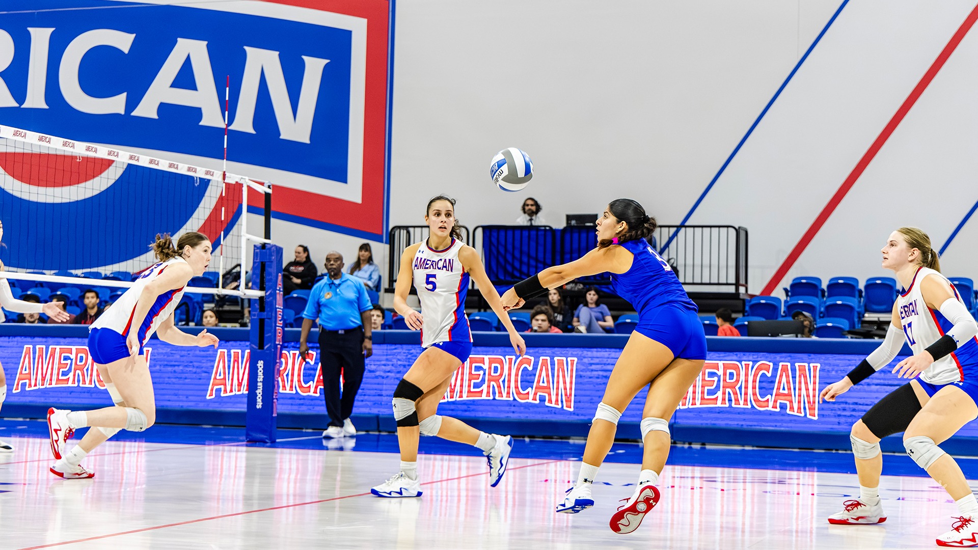 Bella Marrero digging an attack in a volleyball match against Lehigh. 