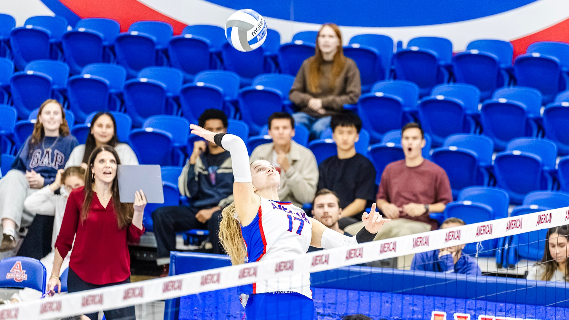 Salme Hollas hitting the ball in a volleyball match