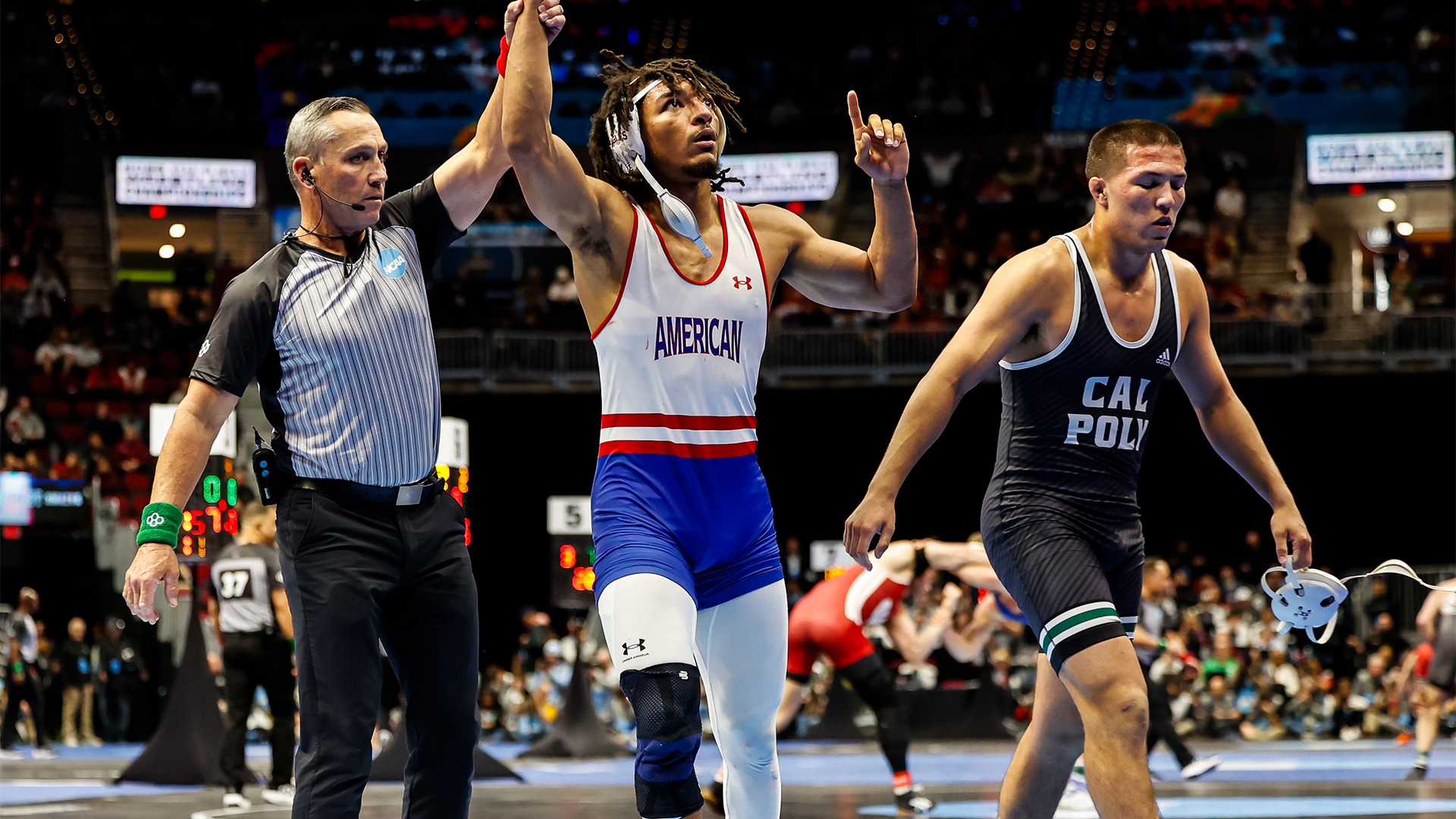 Caleb Campos getting his arm raised at the NCAA Tournament.