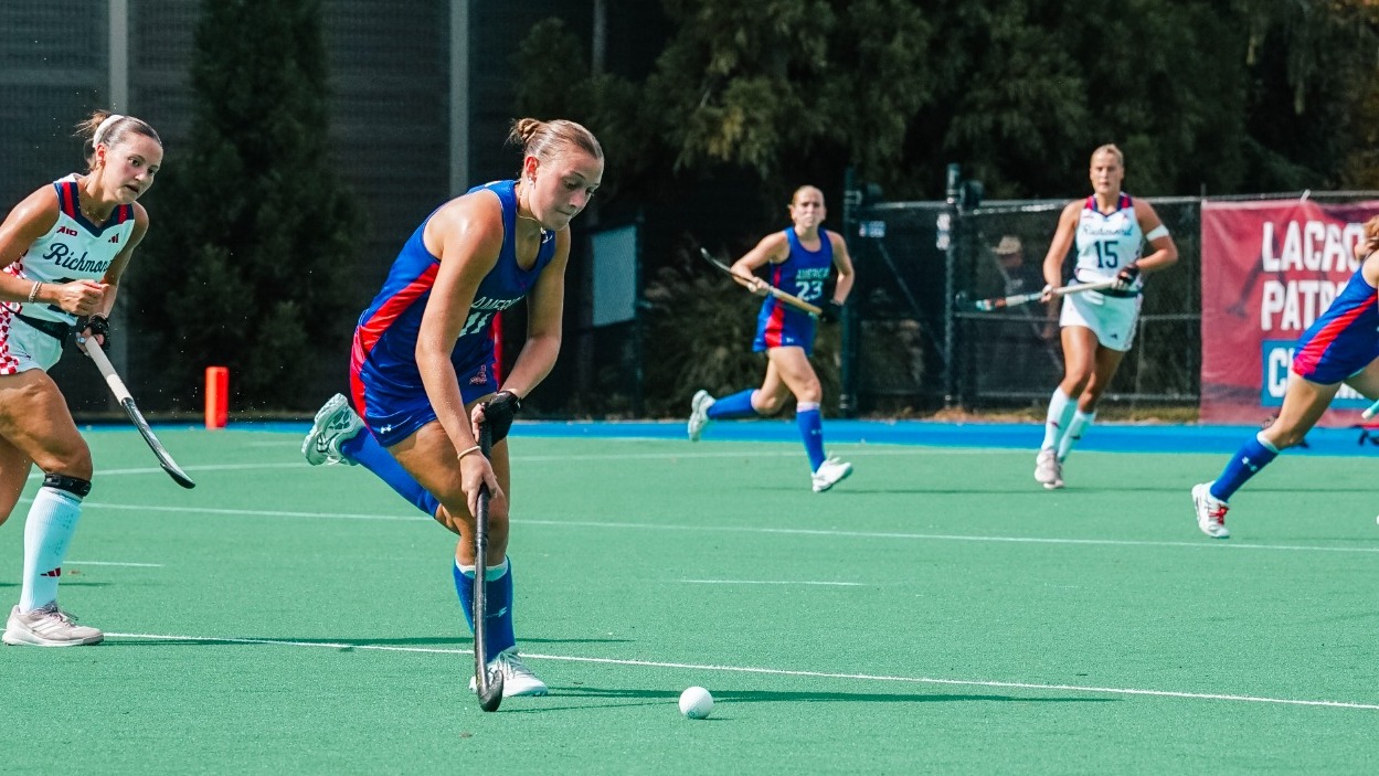 Nora Tromble carries the ball down the field against Richmond