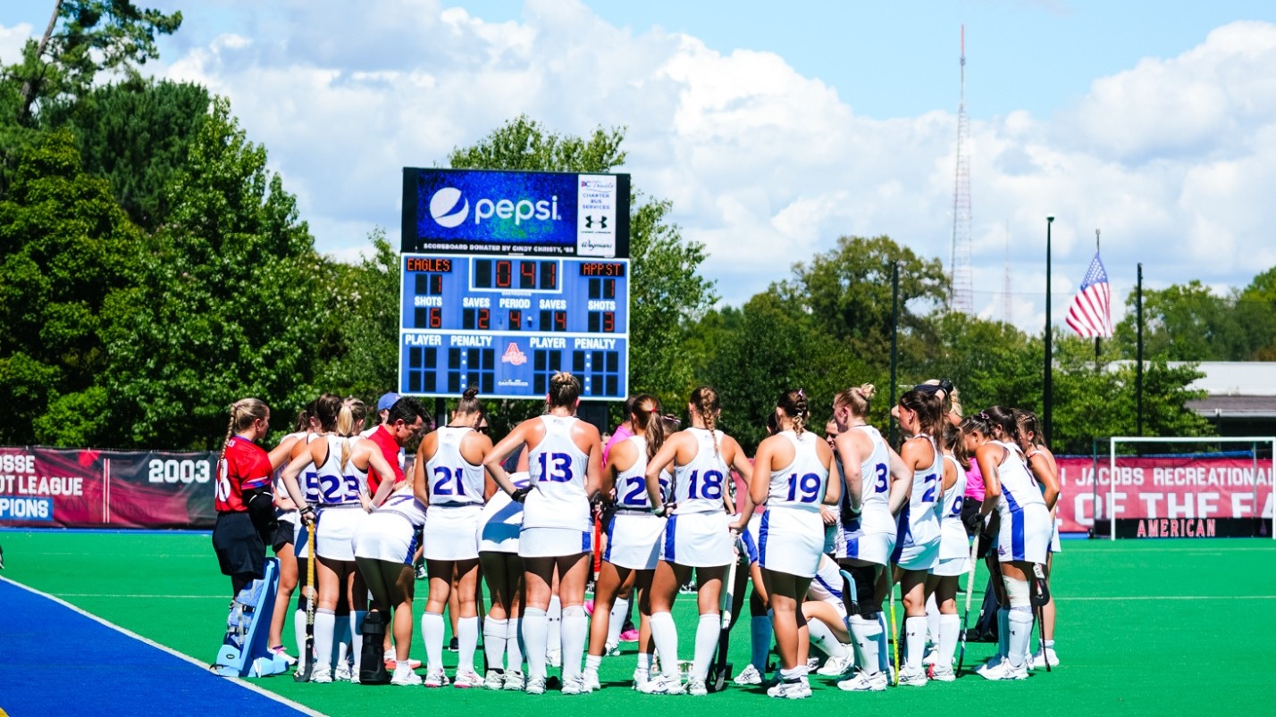 Field hockey huddled together during a break between periods in the game against App State