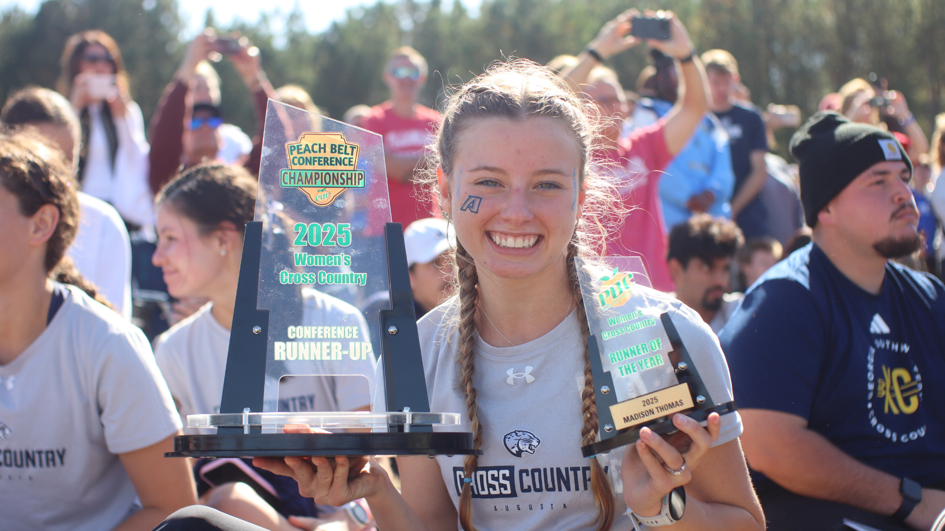 Madison Thomas with trophies