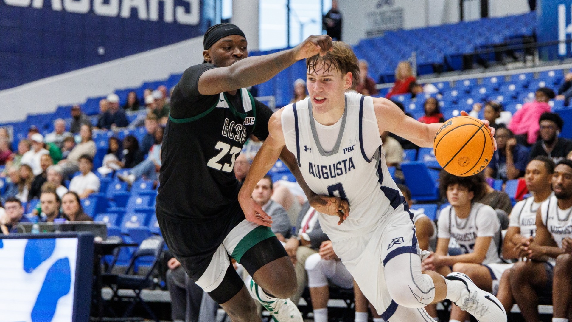 Elias Palsson drives with the basketball