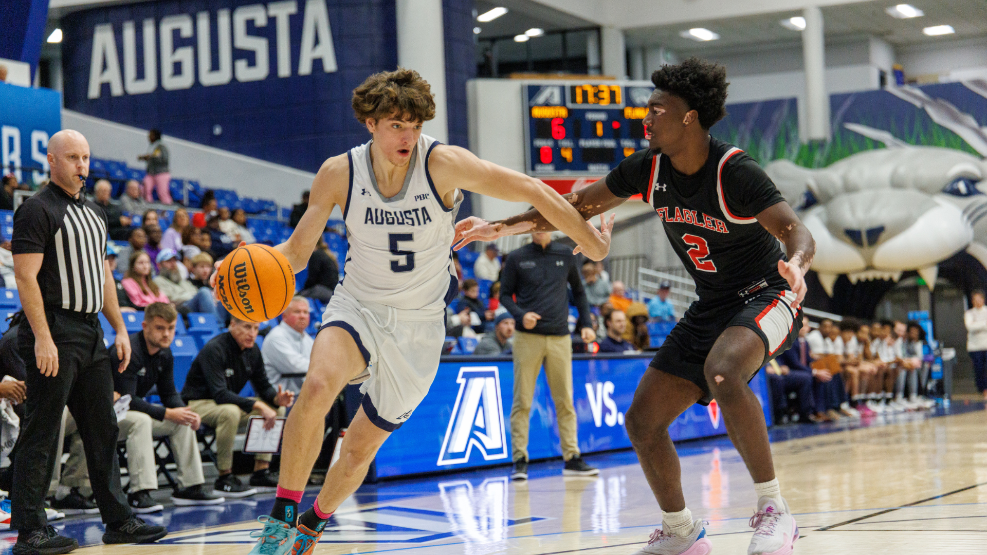 Charlie McBeath driving the basketball