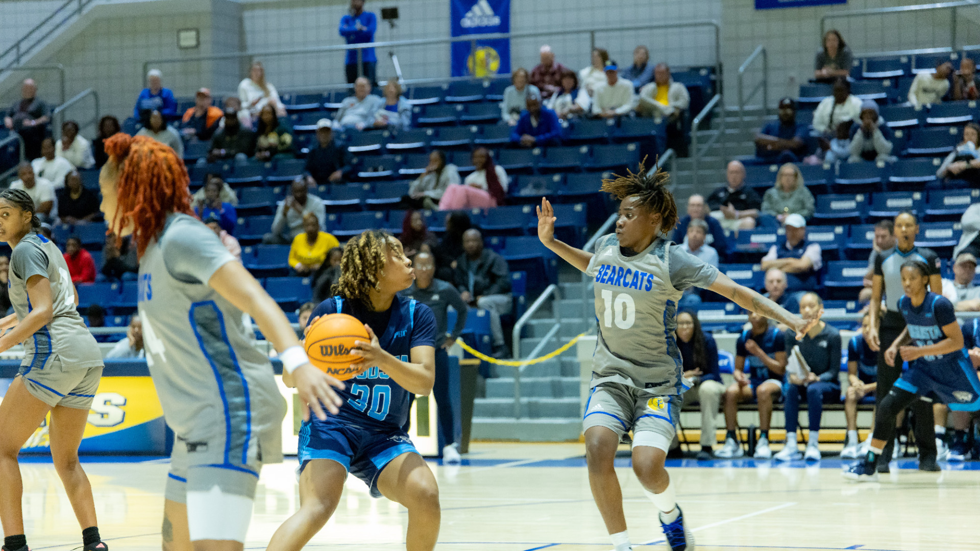 Sierra Burns drives in the lane against Lander on thebasketball court