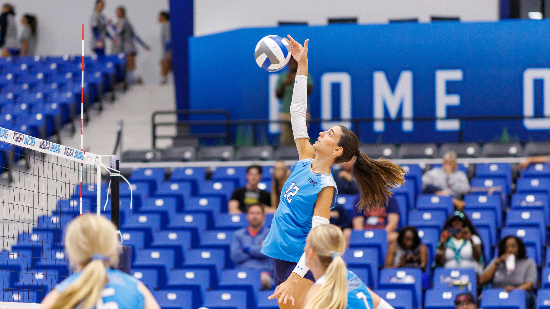 Angela Mateos attacks volleyball