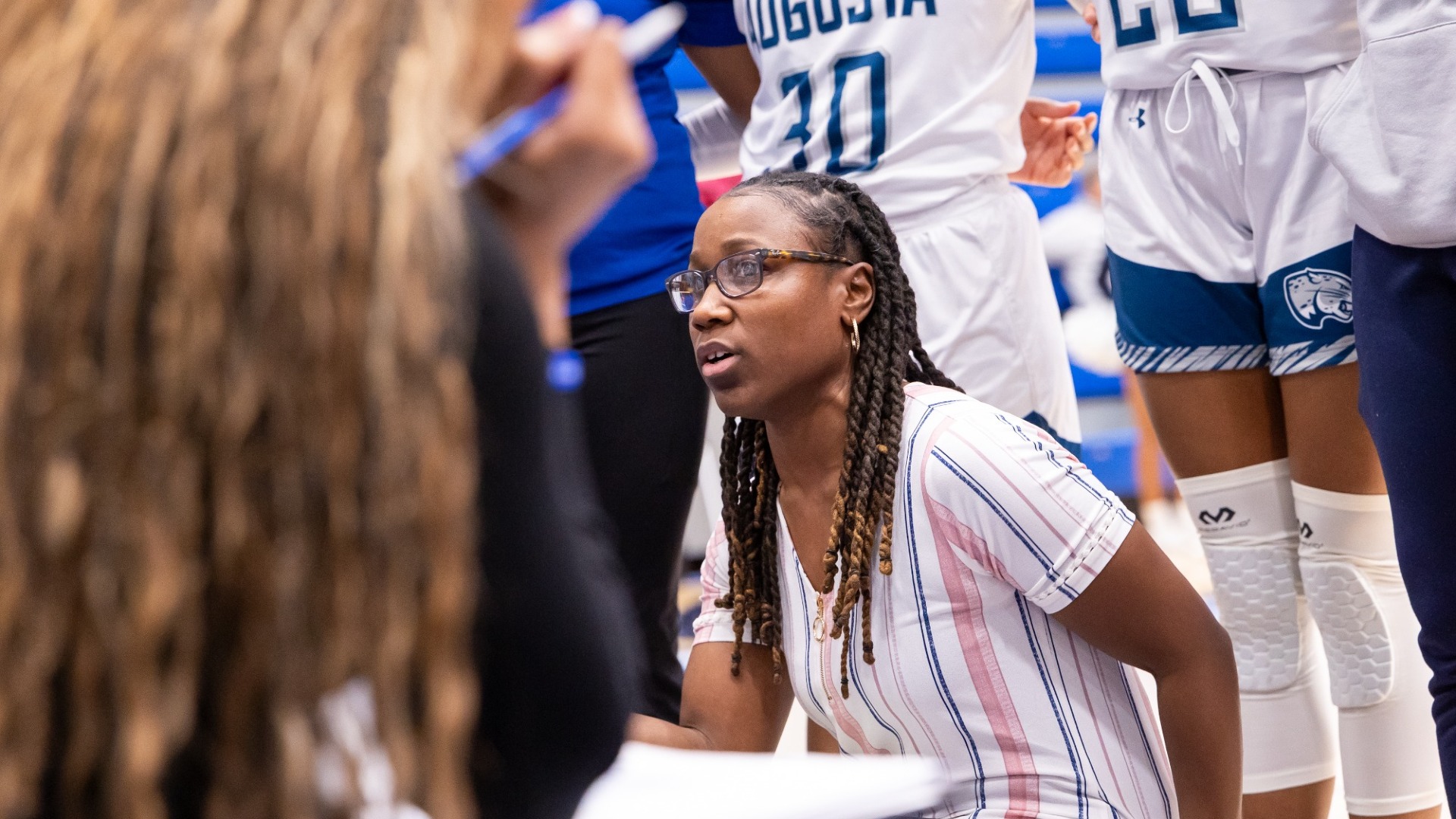 Celeste Stewart talks to the team during a timeout