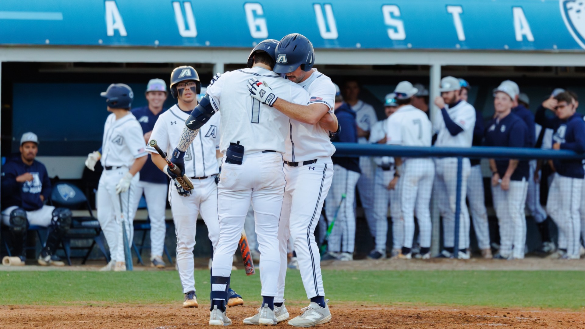 Aiden Cannaday hugs a teammate after a home run