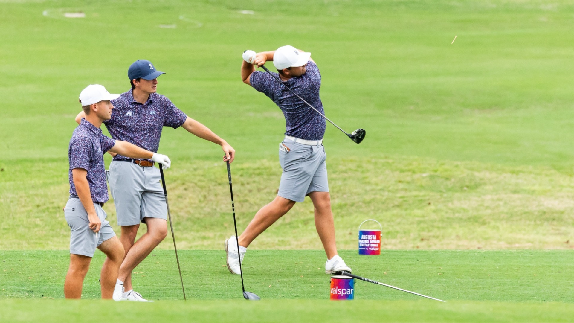 Dean Wilken tees off with Bo Blanchard and Stefan Jacobs watching
