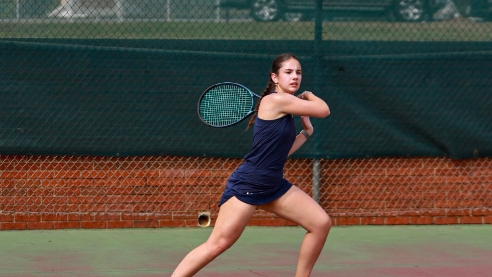Priscilla Landi hitting a tennis ball