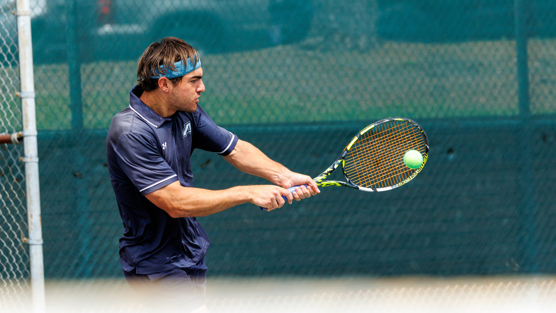 David Perret hits a tennis ball at Newman Tennis Center