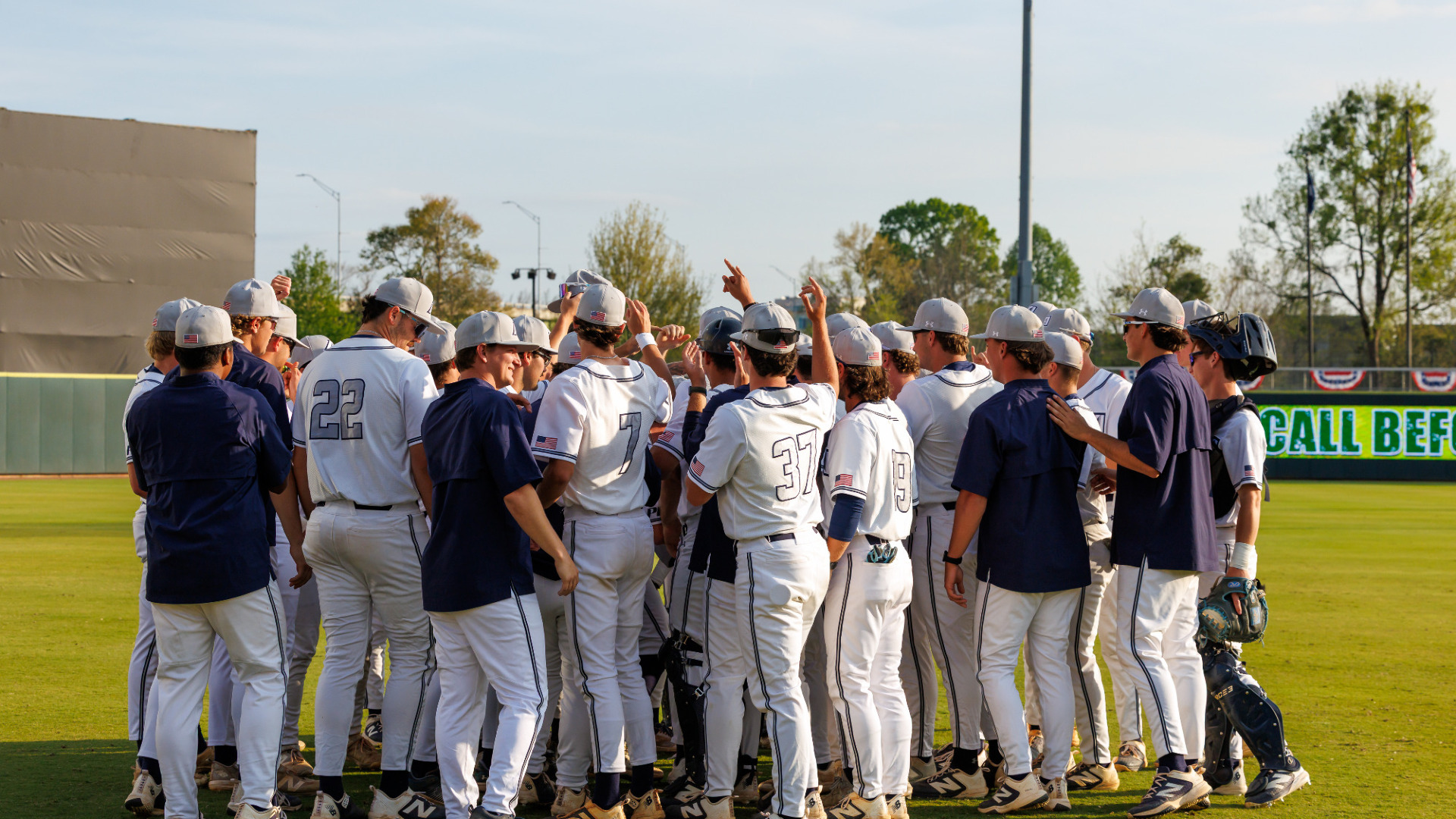 Augusta baseball team huddles on the field