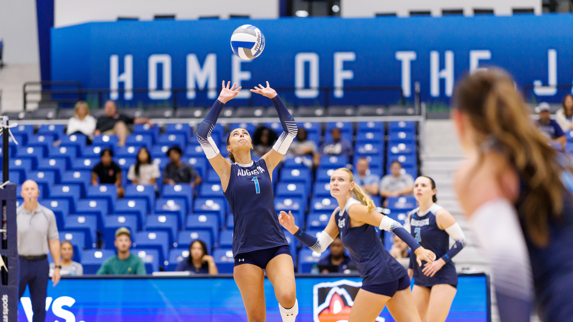 Andrea Rodriguez setting a ball inside Christenberry Fieldhouse