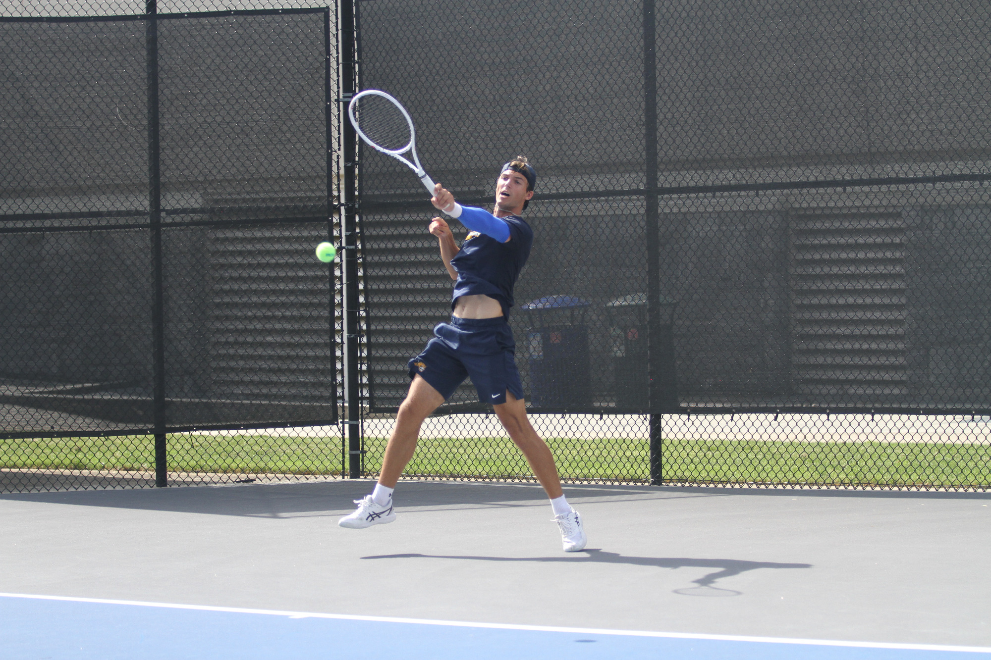 Florian Bert returns a shot during Averett's 2025 NCAA Tournament First Round match against Asbury.