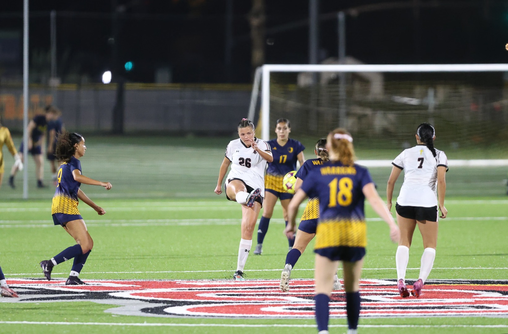 ACU's Ella Barron kicks a shot