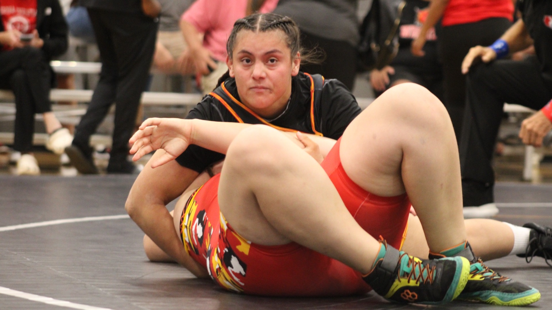 ACU's Nylease Yzagere wrestles her opponent