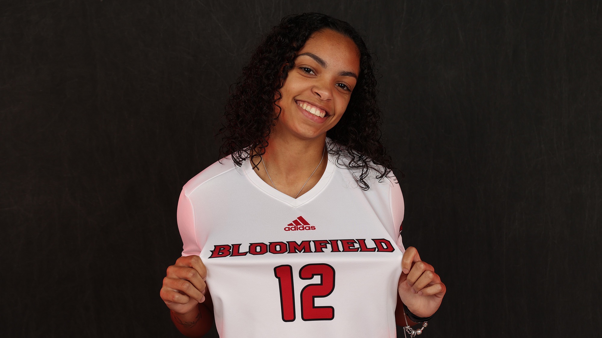 Leigha Bradding Butler popping her game jersey