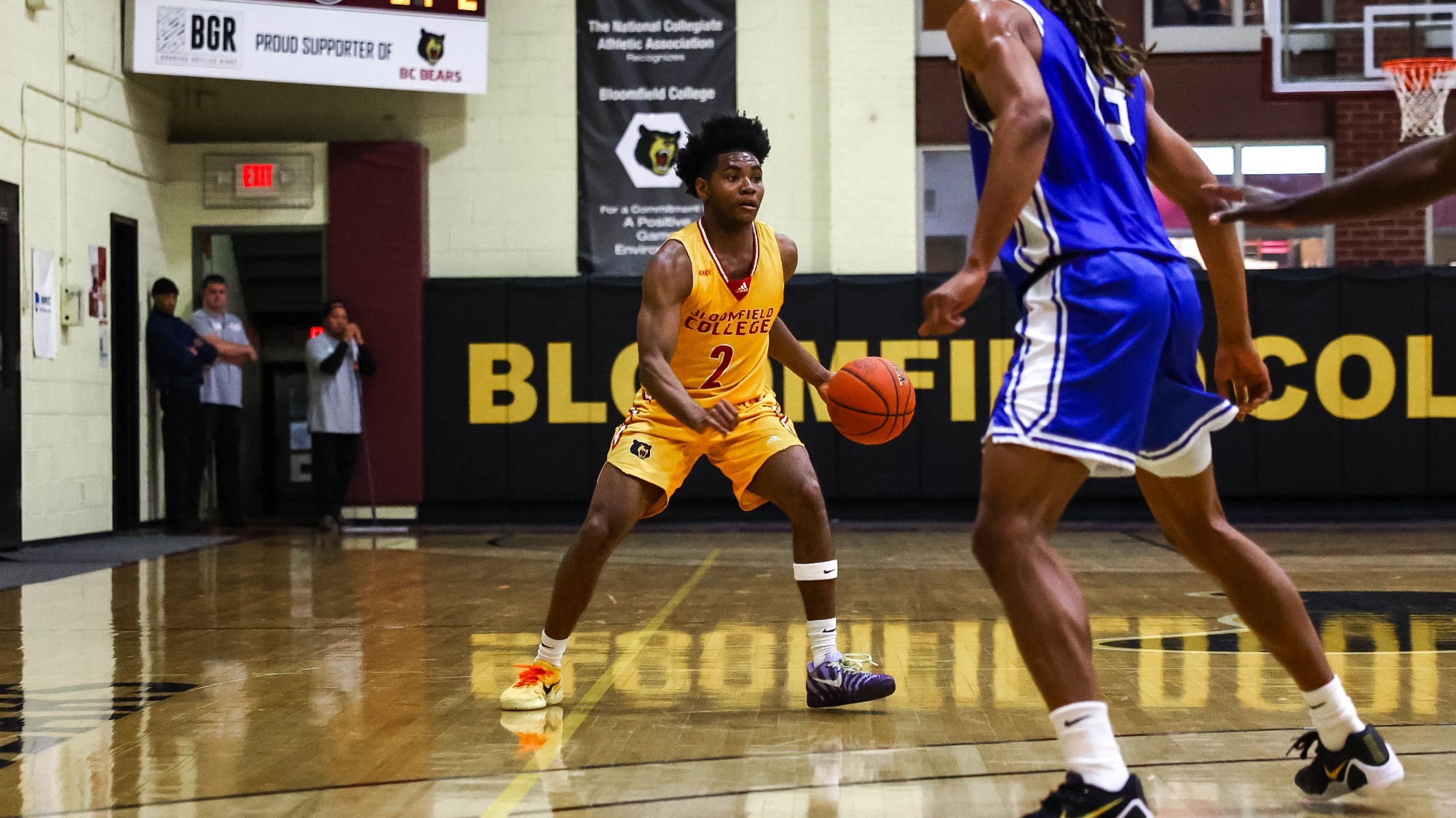 Cameron McRae dribbles up the court against Bobcats of Albany
