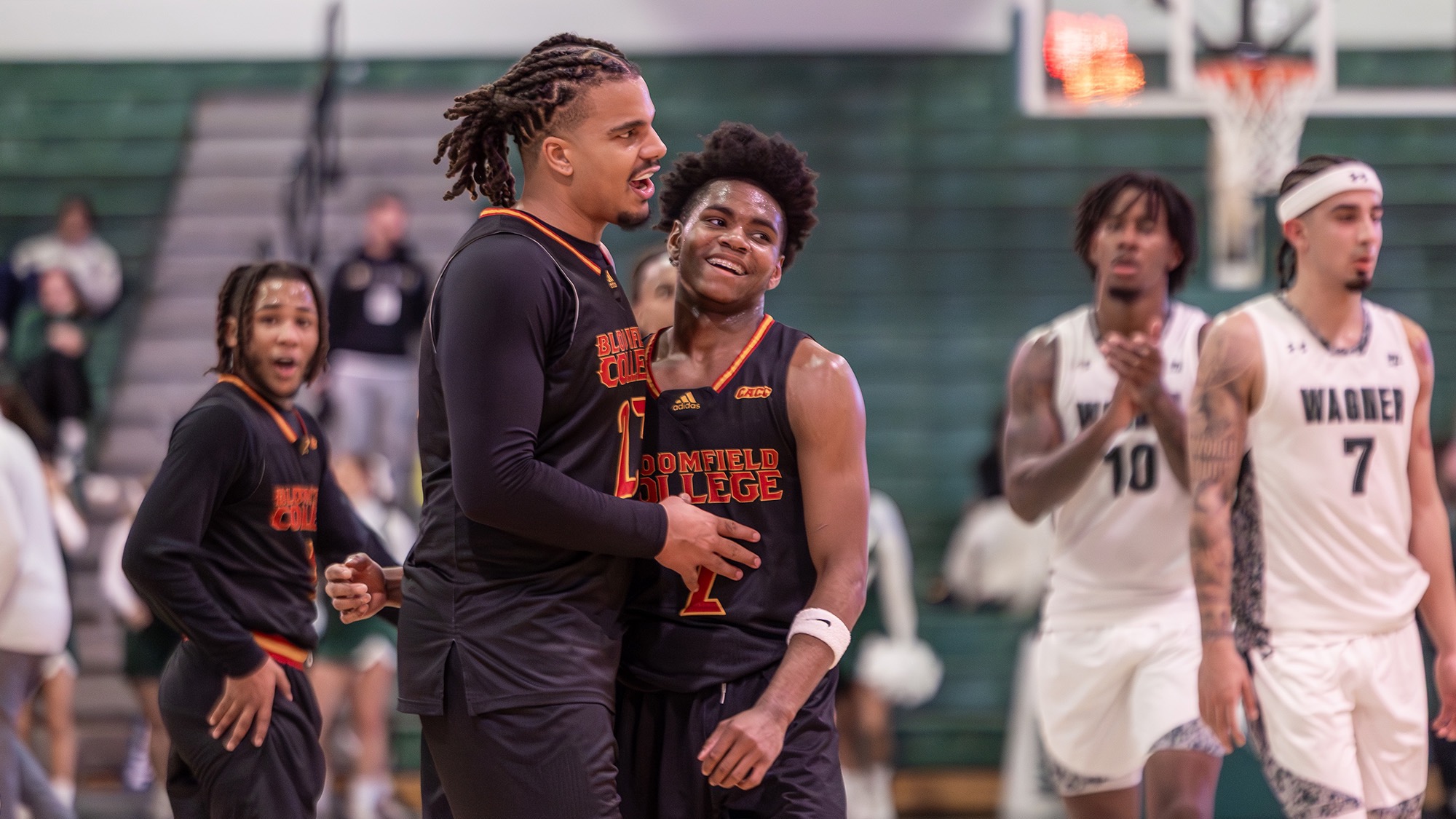 McRae and Bucknall share a laugh during thriller men's basketball game with Wagner
