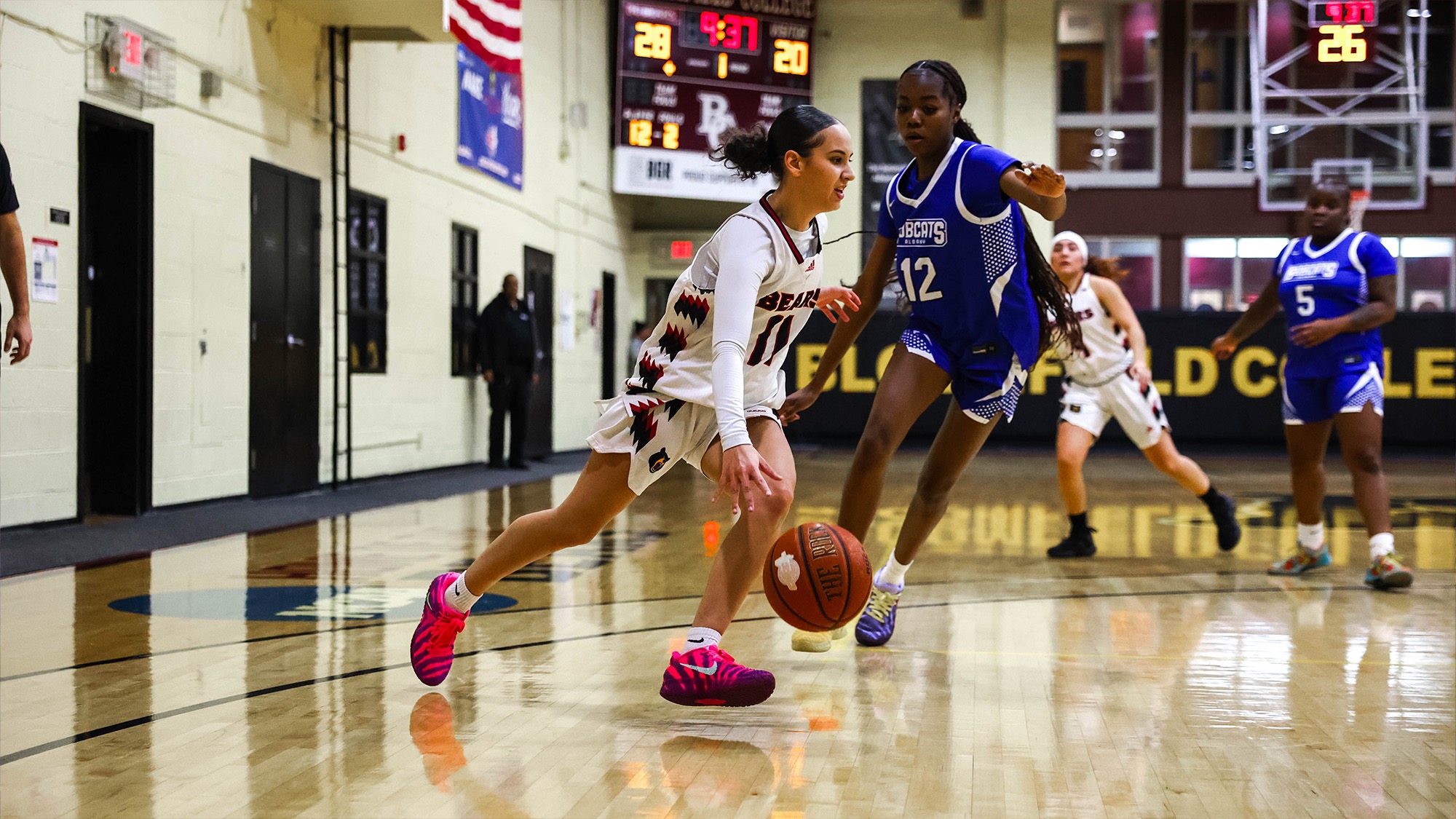 Kaleigh Valle drives to the basket against Bobcats from Albany
