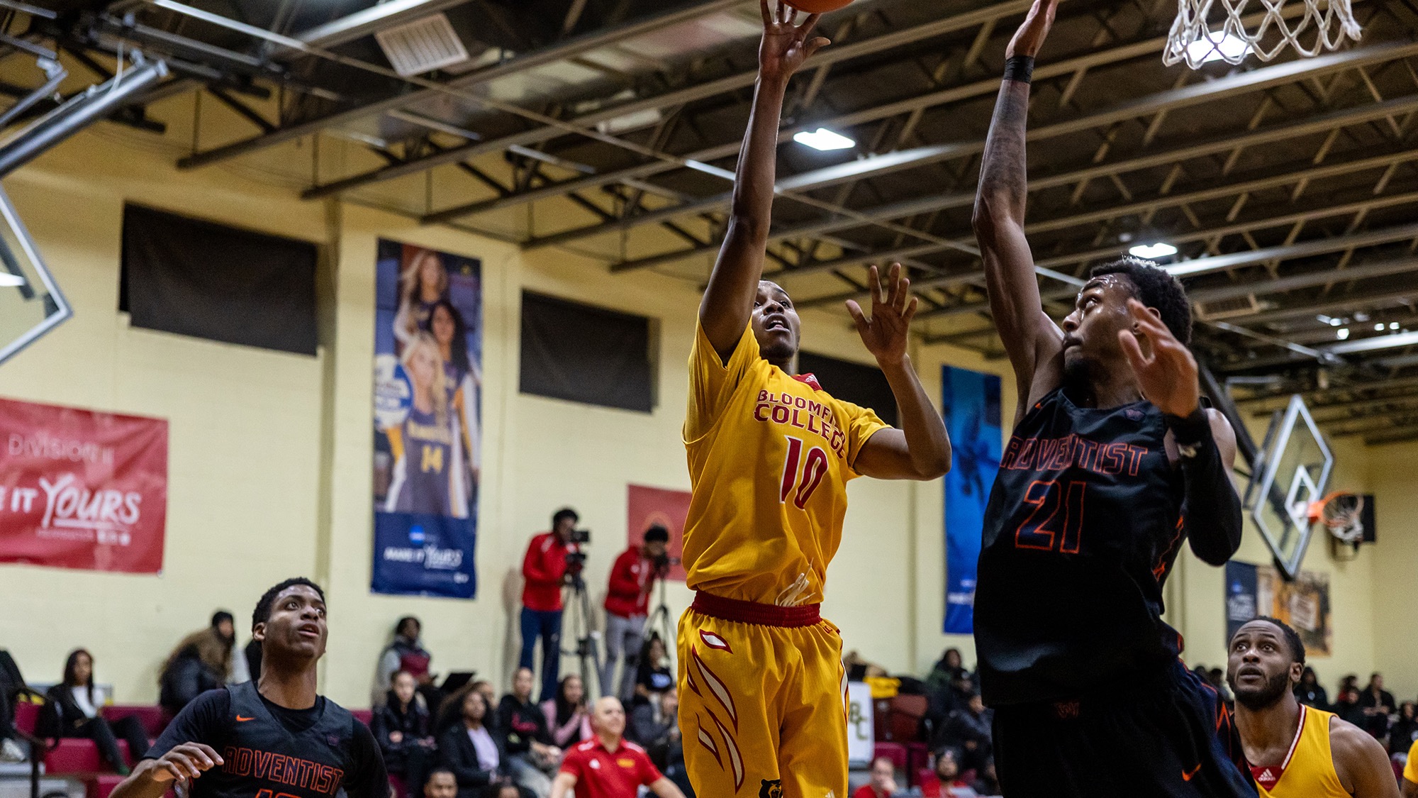 Zambian Singleton puts shot over visiting Washington Adventist basketball player