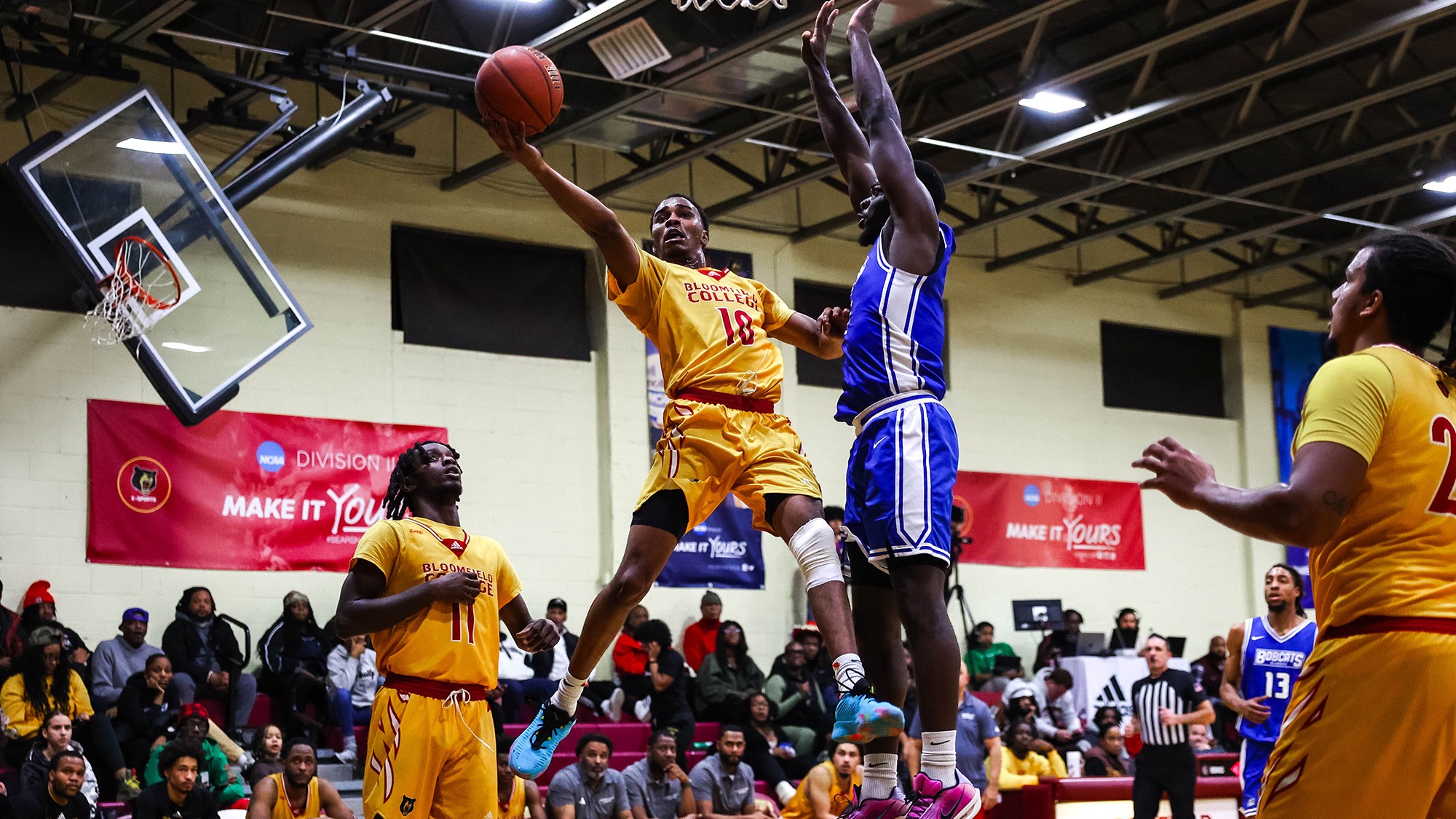 Zamorian Singleton glides in the air for a basket at the rim
