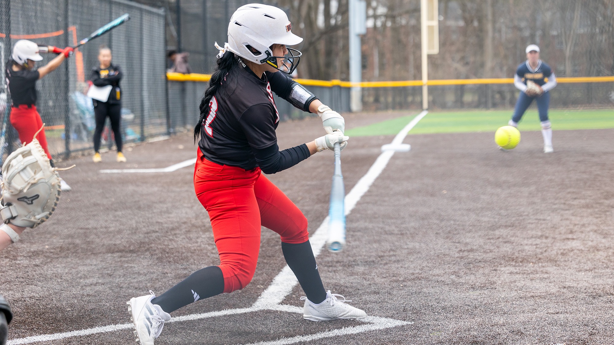 Rayn Romero takes a swing during a Bears softball game at Clarks Pond South
