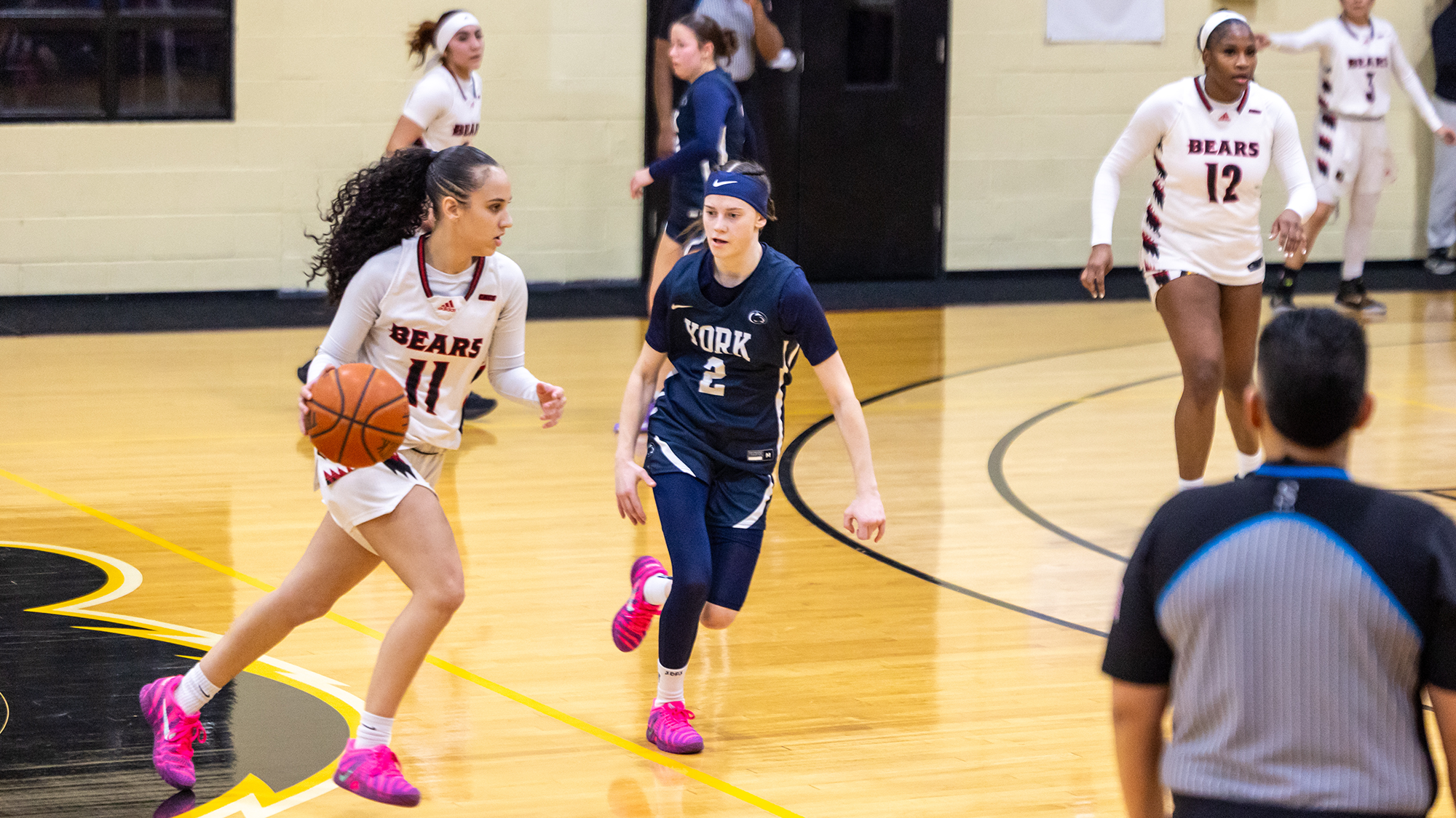 Kaleigh Valle dribbles past York defender on the court