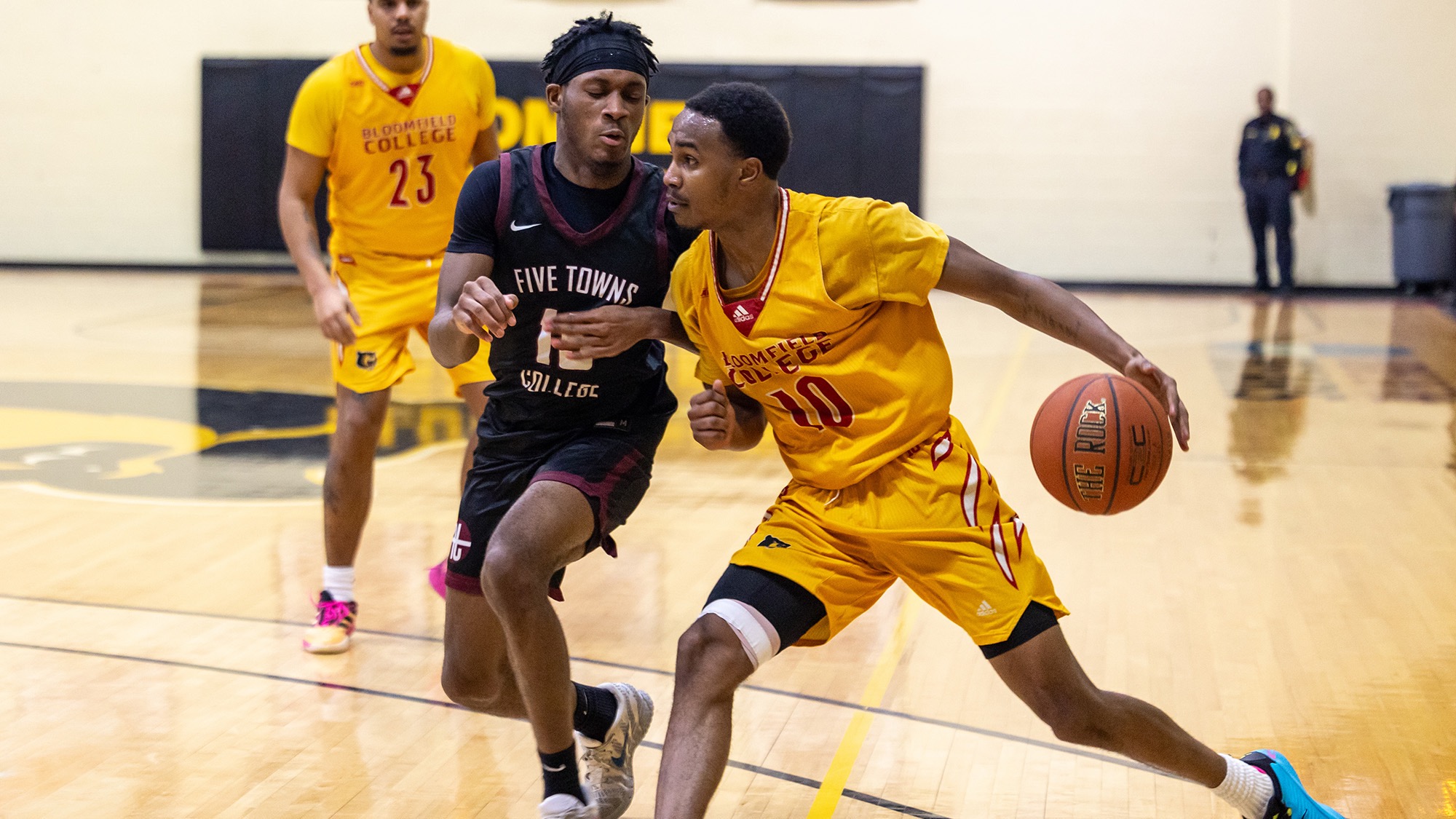 Zamorian Single drives to he basket against Five Towns College